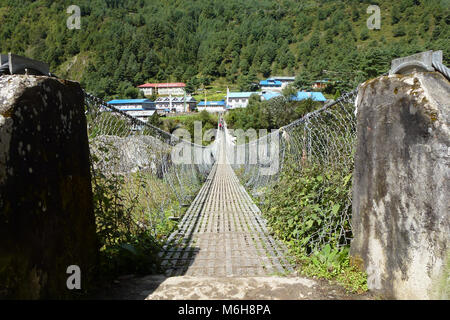 Suspension bridge over a river in Phakding, Everest Base Camp trek, Nepal Stock Photo