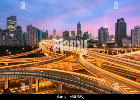Beautiful Shanghai city with interchange overpass at nightfall in Shanghai, China. Stock Photo