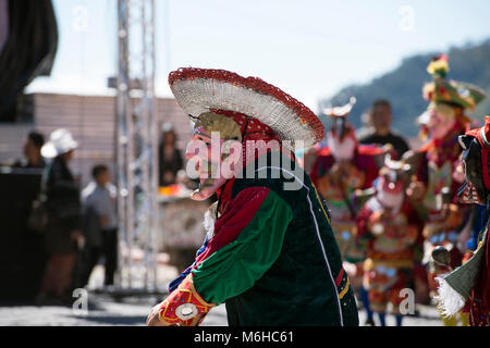 A Mayan man dressed as a conquistador at an ancient Mayan ritual at the 2013 Rukux festival in Sololá, Guatemala. Stock Photo