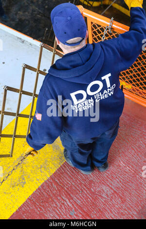A department of transportation worker on the Staten Island ferry, NYC, USA Stock Photo