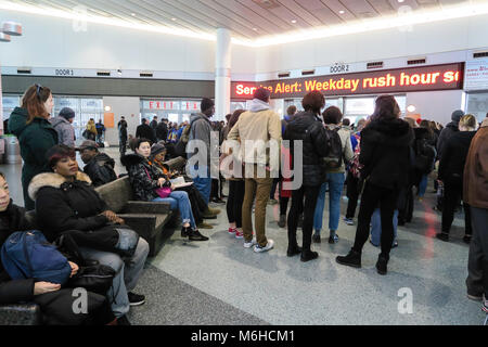 Passengers await the next Staten Island Ferry departure at Whitehall Terminal in Lower Manhattan, NYC, USA Stock Photo