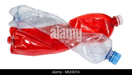 Used plastic bottles in red and blue. Two empty beverage packages isolated on white background. Waste sorting, recycling and  environmental pollution. Stock Photo