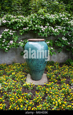 Spring flowers vase, garden urn pottery container display, Chanticleer Botanical Garden, Wayne, Pennsylvania, USA, landscaping container gardens urn Stock Photo
