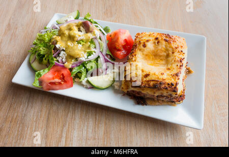 Moussaka with a Greek salad Stock Photo