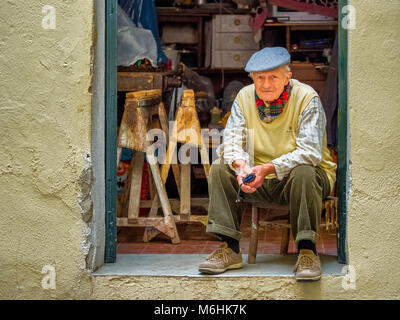 Elderly craftsman in his shop on the Island of Ischia, Italy Stock Photo