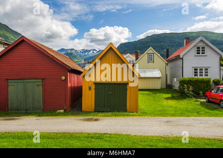 colourful boathouses and mountain view, Norway, wooden huts in Vik i Sogn, Sognefjorden Stock Photo