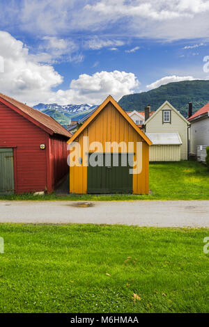 colourful boathouses and mountain view, Norway, wooden huts in Vik i Sogn, Sognefjorden Stock Photo