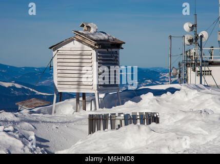 weather station in winter mountain landscape. Romania Stock Photo