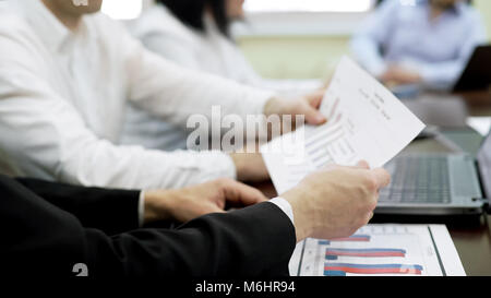 Two managers holding report document, developing company strategy, business Stock Photo