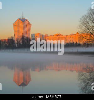 Belarus, Minsk - April 4, 2017: landscape of the Writers' Park in the Morning Mist, View of the Residential Area Along Frunze Street in Morning Time Stock Photo