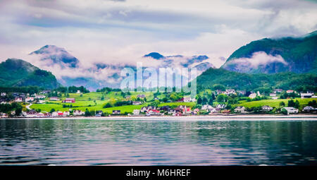 Waiting for the ferry crossing while going from Odda to Stavanger in Norway overlooking Fjords Stock Photo