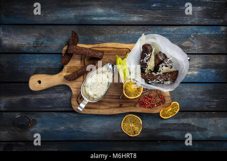 Appetizing fried golden brown croutons of rye and wheat bread on the rustic wood Stock Photo