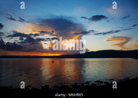 Dramaric clouds at sunset on Bracciano Lake at Trevignano Romano, Lazio, Italy. Stock Photo