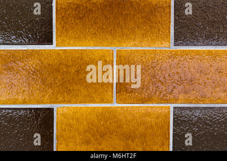 Brick wall close-up. Yellow and brown in an interesting pattern. Shot in Stockholm, Sweden. Stock Photo