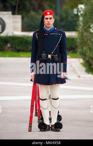 Evzones, Greek Presidential Guards marching in their everyday winter ceremonial uniform in front of the House of Parliament, in Athens, Greece. Stock Photo