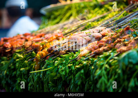 Fresh meat skewers on display at a food stall in Jemaa el-Fnaa market, Marrakesh, Morocco Stock Photo