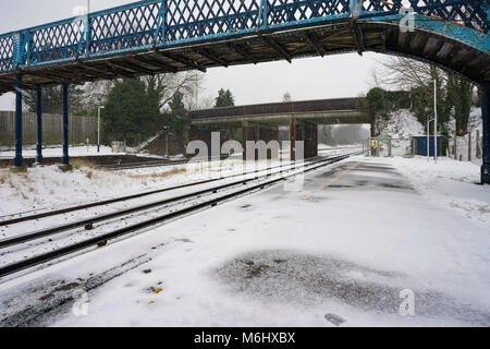 Mainline tracks through Hook Station in Hampshire during snowy weather Stock Photo