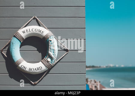 Decoration life ring with 'Welcome aboard' word decorate on wall Stock Photo