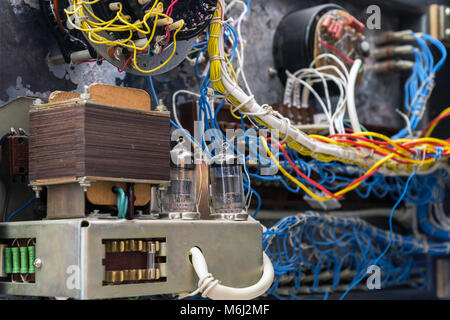 Transformer, radio tubes and wires. Old radio lamp device. Lamp receiver. Inside view. Selective focus Stock Photo