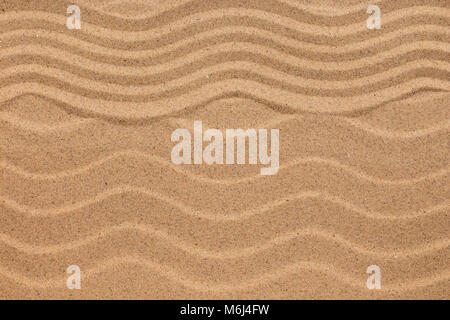 Zigzag and sand dunes, sand texture, background. View from above Stock Photo
