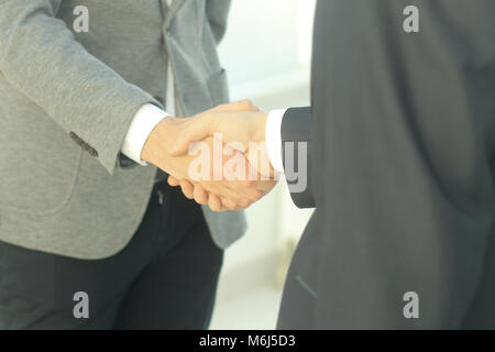 closeup .the financial partners shaking hands over a Desk Stock Photo