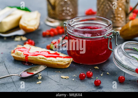 Red currants jam and berries, close view Stock Photo