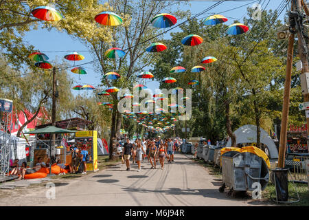 Festivalgoers walk under umbrellas at the Sziget Festival in Budapest, Hungary Stock Photo