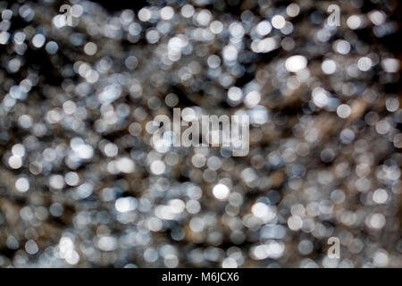 Sparkling spots of Bokeh - a metal surface is not in focus, the background, metal, blue tint Stock Photo