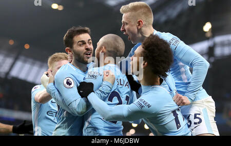 Manchester City's Bernardo Silva (centre) celebrates scoring the games first and only goal during the Premier League match at the Etihad Stadium, Manchester.