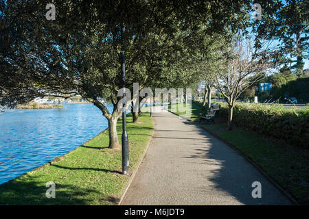 A path alongside Trenance Boating Lake in Newquay Cornwall. Stock Photo
