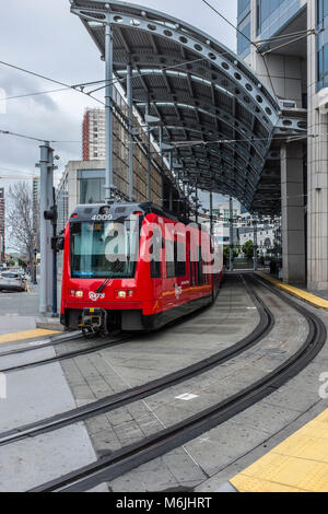 SAN DIEGO, CALIFORNIA, USA - Red San Diego trolley in downtown part of the city on Broadway Street Stock Photo