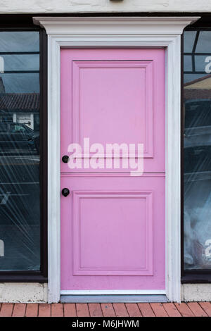 Stylish pastel pink front door in California, USA. Stock Photo