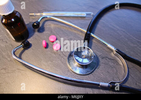 Stethoscope, pill,drop and thermometer, medical concept Stock Photo