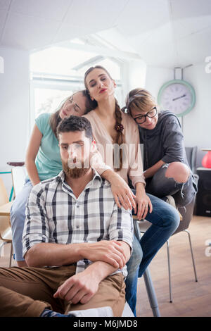 Sleepy young people suffering of depression or workplace demotivation Stock Photo