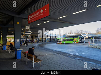 Berlin, Germany - February 14, 2018: Berlin Central Bus Station with people, buses and info signboard Stock Photo