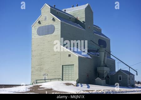 Grain Elevator Wood Structure Silos Exterior in Winter. Town of Milk River, Southern Alberta, Canada Prairies near US Montana Border Stock Photo