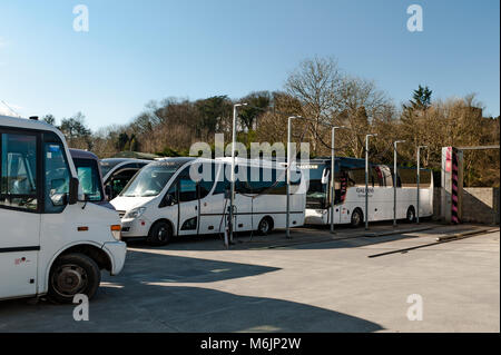 Coaches parked in the yard of Galvins Coach Company, Dunmanway, County Cork, Ireland with copy space.