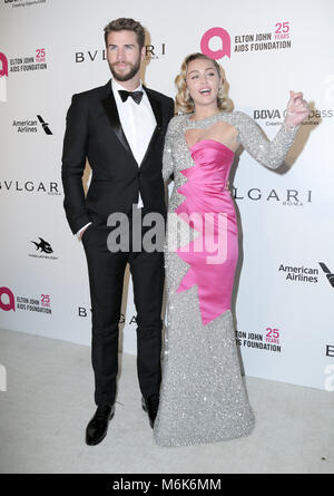 Hollywood, California, USA. 4th Mar, 2018. Actor CHRIS HEMSWORTH and Singer MILEY CYRUS attend the 26th Annual Elton John Academy Awards Viewing Party held at West Hollywood Park. Credit: Pma/AdMedia/ZUMA Wire/Alamy Live News Stock Photo