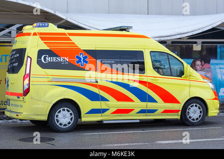 SALZBURG, AUSTRIA - March 03, 2018:  Austrian yellow Ambulance near the airport ready to transport sick people to hospital Stock Photo