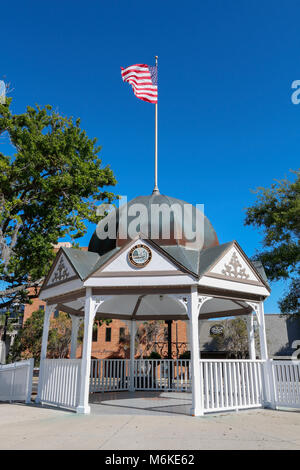 A landmark gazebo with American flag in the historic downtown square in Ocala Florida Stock Photo