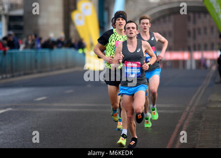 Josh Griffiths elite runner running in the Vitality Big Half marathon crossing Tower Bridge, London, UK Stock Photo