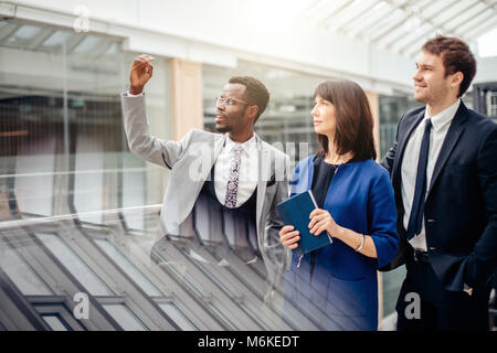 african architects show result of working on construction Stock Photo
