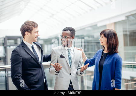 Multiracial Business Team congratulate For Success Of afroamerican Colleague Stock Photo