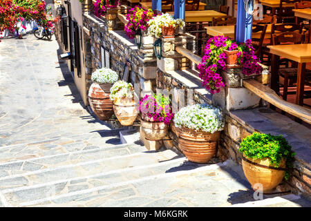 Old streets of greece,view withrestaurant with floral decoration,Naxos. Stock Photo