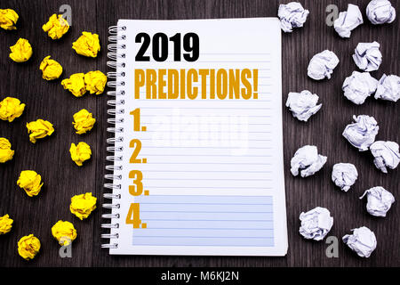 Conceptual hand writing text caption showing 2019 Predictions. Business concept for Forecast Predictive Written notepad note notebook book wooden back Stock Photo