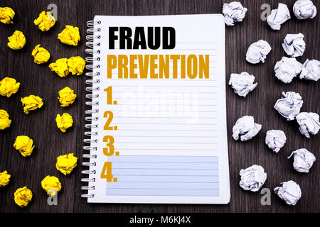 Conceptual hand writing text caption showing Fraud Prevention. Business concept for Crime Protection Written notepad note notebook book wooden backgro Stock Photo