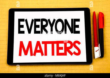 Conceptual handwriting text caption inspiration showing Everyone Matters. Business concept for Equality Respect Written on tablet, wooden background w Stock Photo