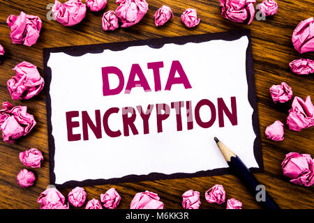 Hand writing text caption inspiration showing Data Encryption. Business concept for Information Security Written on sticky note paper, wooden backgrou Stock Photo