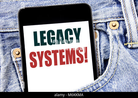 Hand writing text caption inspiration showing Legacy Systems. Business concept for Upgrade SOA Application written on smartphone in jeans pants. Blue  Stock Photo