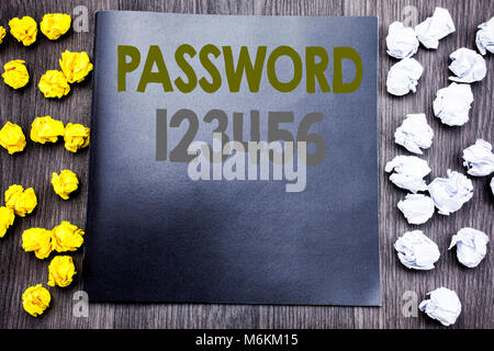 Hand writing text caption inspiration showing Password 123456. Business concept for Security Internet Written on notepad note notebook wooden backgrou Stock Photo